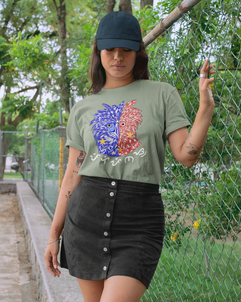 Tattooed woman wearing a sage green Filipino pride shirt, Philippine Eagle design