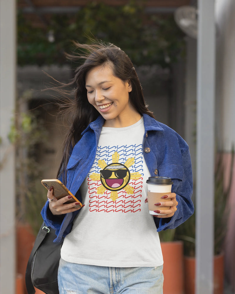 Pinay checking her phone in a Baybayin t-shirt, street-style filipino streetwear look.