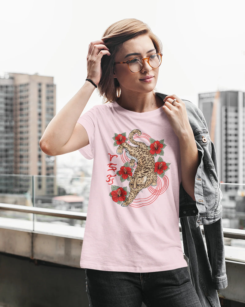 Woman against a city skyline wearing a visayan cultural shirt with Badlit leopard cat design