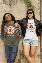 Two Pinoy friends wearing Filipino couple t-shirts with a circular design and a badlit figure featuring the word Sugbo Cebu in Suwat Bisaya script