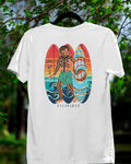 White Surfin' Siargao Badlit tee on a hanger in a nature setting