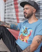 2nd Generation Filipino wearing a blue t-shirt with a colorful visayan graphic design showing a dancing bisaya figure and ancient filipino script