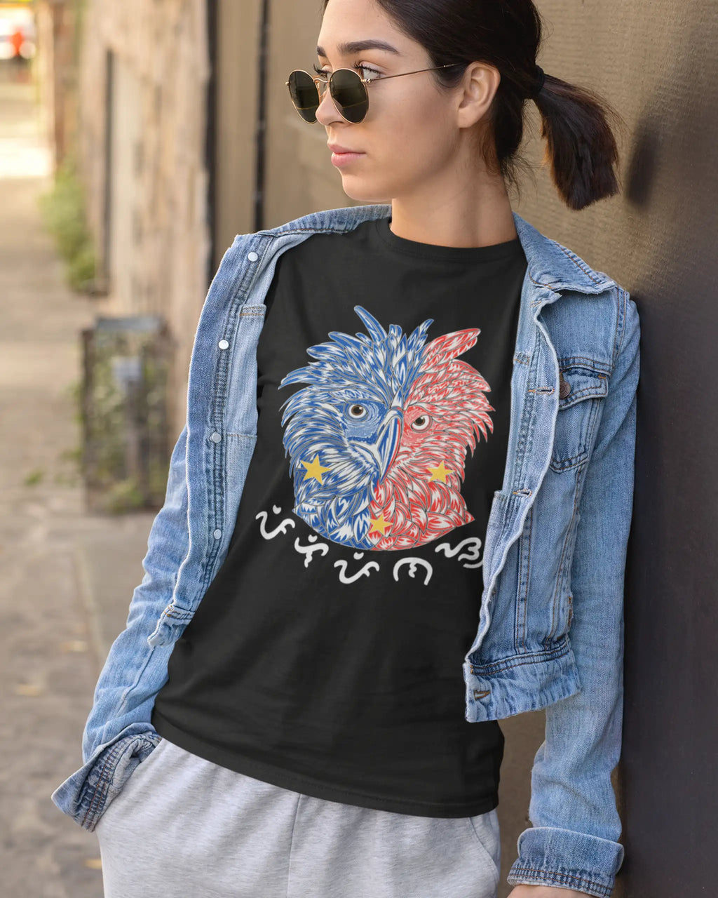 Woman in a black Philippine Eagle shirt with Pilipinas script, athleisure style