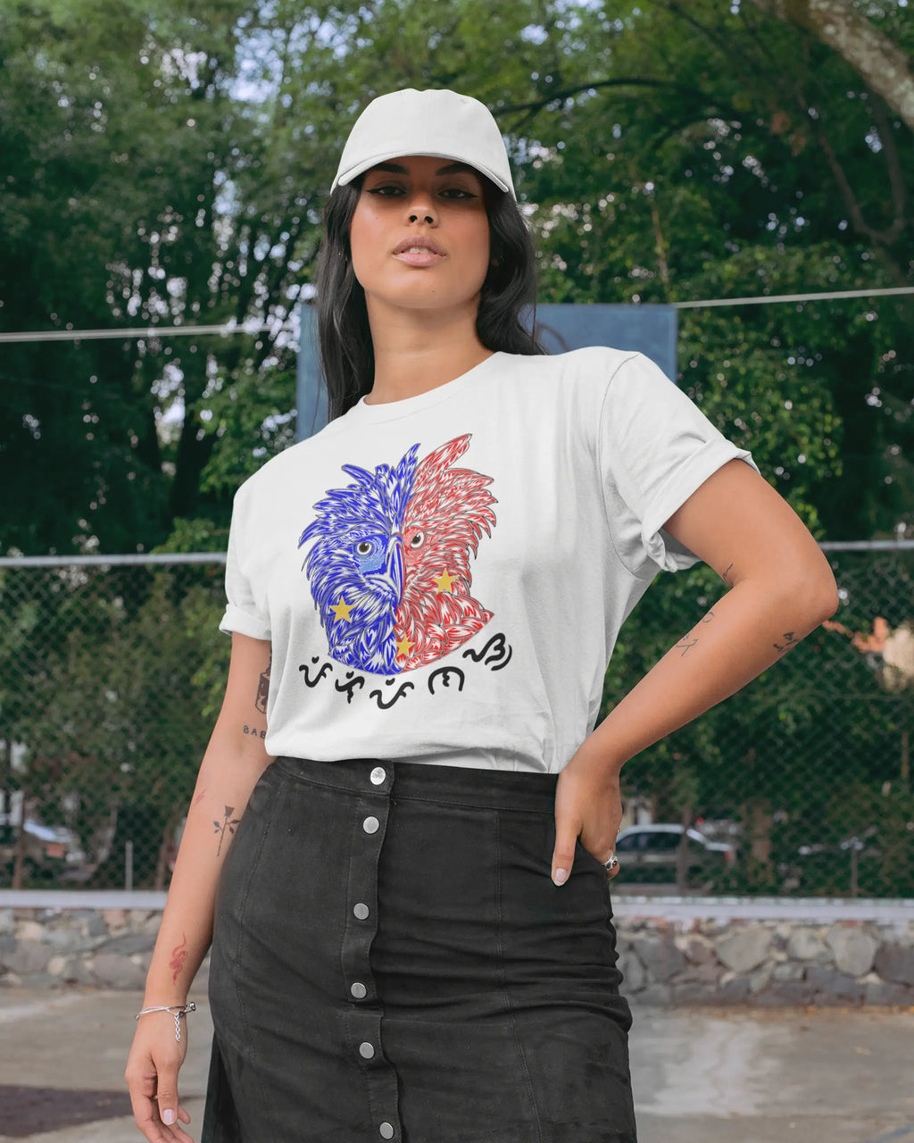 Woman in a white Pinoy pride shirt with the Philippine Eagle design, trees in the background