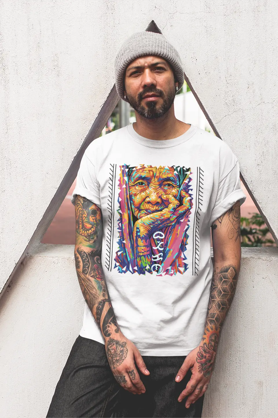 Filipino Man wearing a cotton Apo Whang Od T-shirt with vibrant tattoo art tribute and Baybayin Batikan lettering on it.