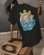 Black Pilipinas koi shirt on a vintage chair, close-up of the filipino tribal art design.