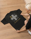 Black Pilipinas shirt laid flat, featuring the Baybayin sun and wave motif of this Filipino heritage shirt.