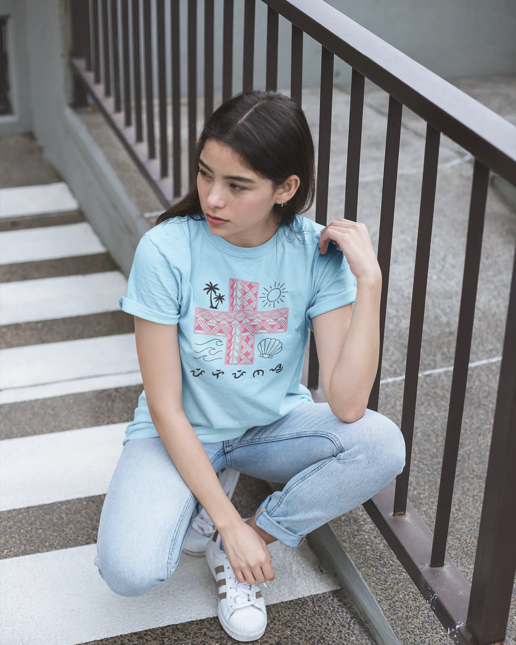 Light blue Pilipinas shirt worn on outdoor stairs, a casual look for this Baybayin filipino heritage shirt.