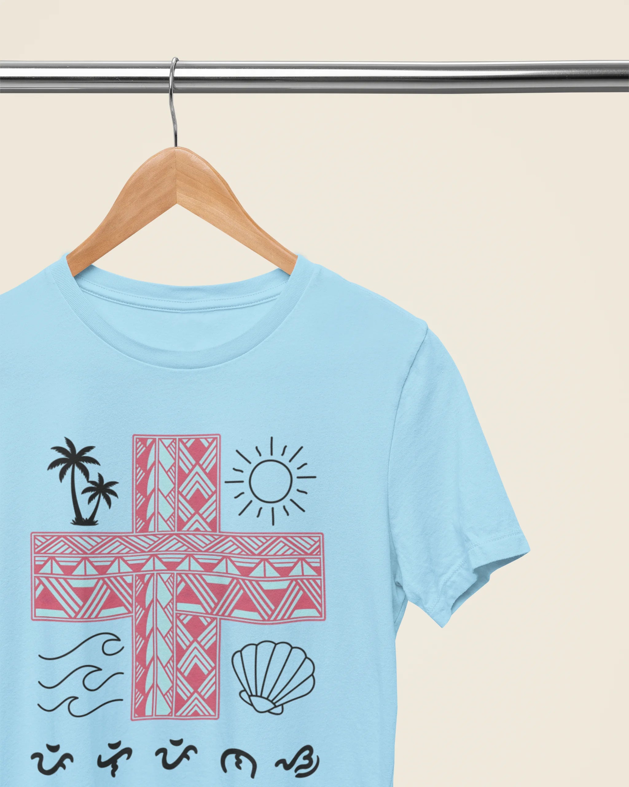 Ocean blue Pilipinas shirt on a hanger, close-up detail of the Baybayin script and tribal pattern.
