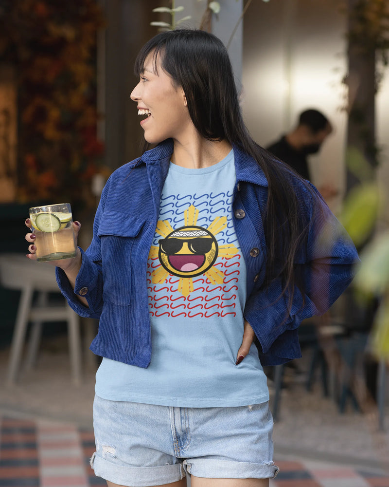 Filipina holding a drink wearing a Baybayin shirt, playful filipino streetwear brand style.