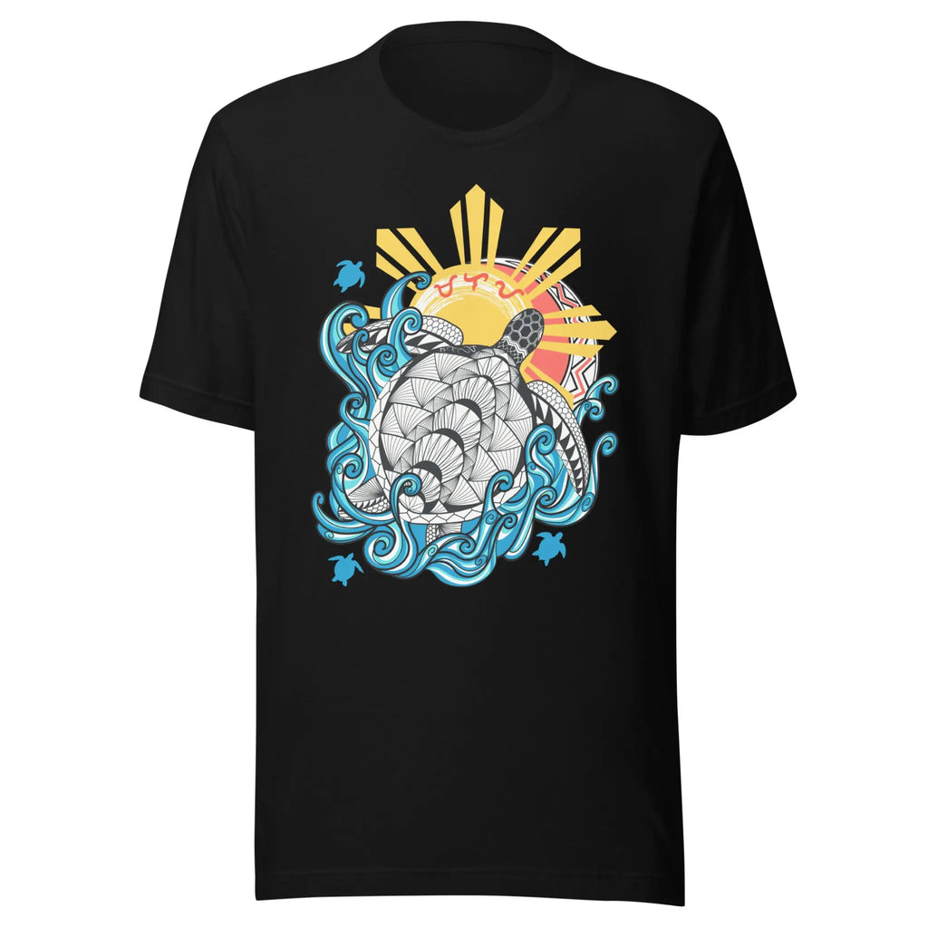Graphic t-shirt featuring a stylized sea turtle with intricate geometric patterns on its shell, swimming through blue waves. Behind the turtle is a traditional eight-ray Philippine sun, layered over circular tribal weaves. The Baybayin script for "Malaya" is written in red across the sun.
