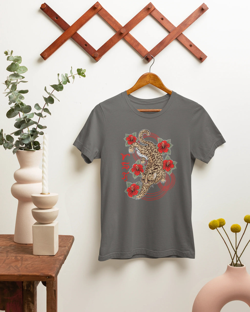Asphalt grey bisaya shirt on a hanger, featuring the Visayan leopard cat Badlit script