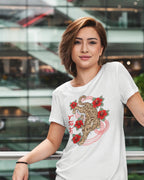 Woman wearing a Visayan cultural shirt with Badlit script and leopard cat design, city backdrop