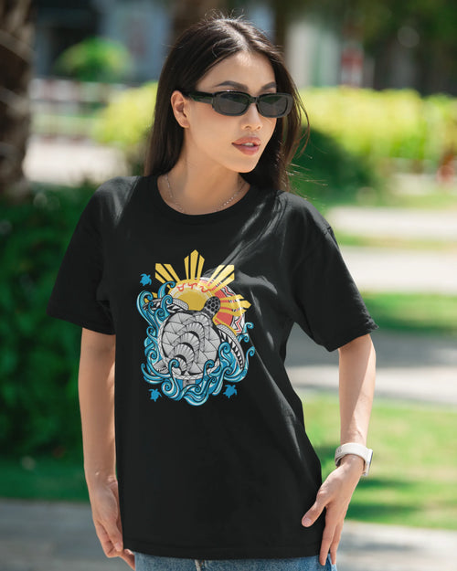 Baybayin Malaya Pawikan tee in black – close-up lifestyle shot at golden hour